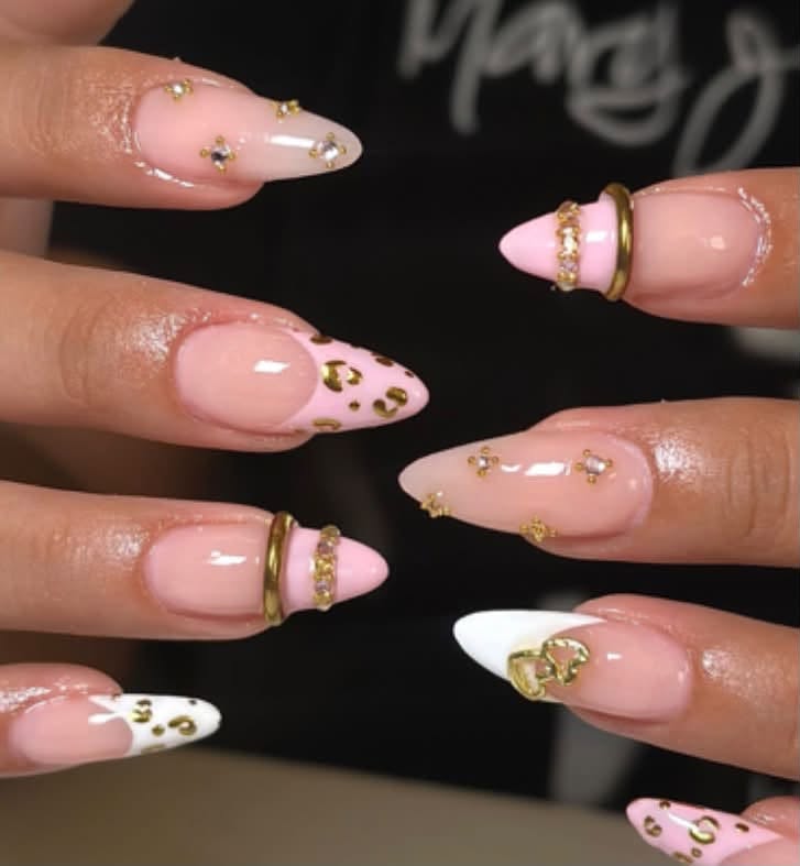Almond nail overlays with gold rhinestones and leopard print detailing